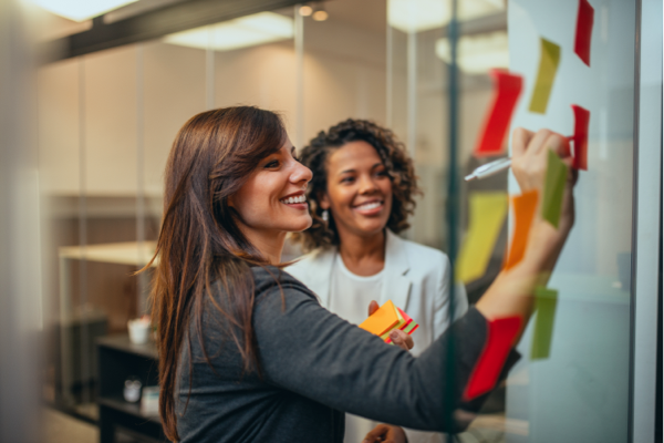 Two people at a whiteboard