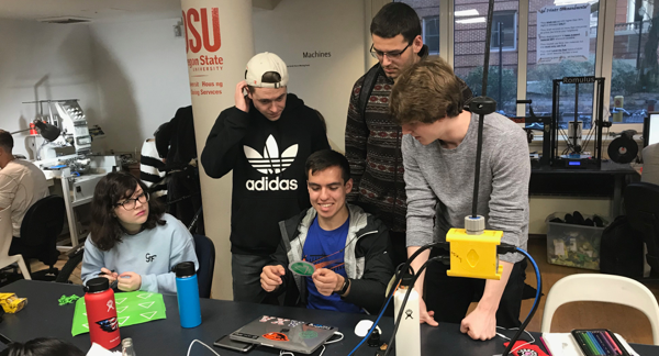 A group of OSU College of Business students working in the DAMlab