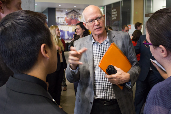 A mentor talks with College of Business students at the Career Fair