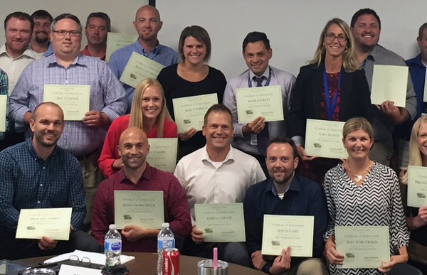 Group of Gallo employees with their College of Business certificates