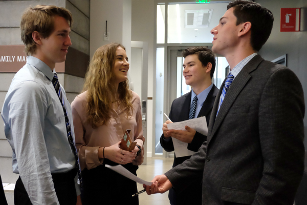 A group of College of Business students networking