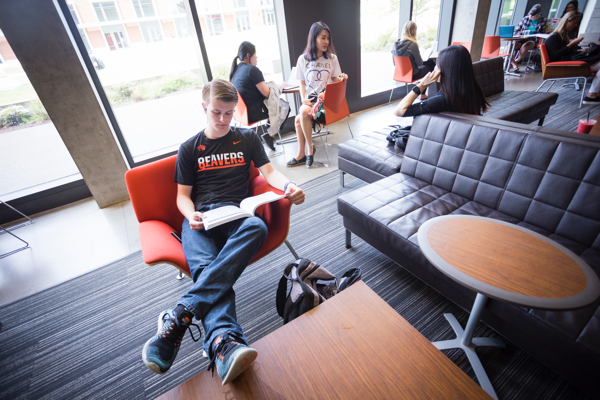 A College of Business student studying in Austin's common area