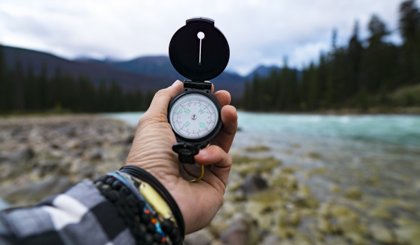 A person holding a compass